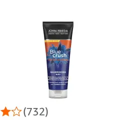 Tube de shampoing bleu John Frieda "Blue Crush for Brunettes". Idéal pour neutraliser les reflets indésirables, avec un temps de pause court pour des résultats rapides.