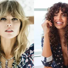 Deux femmes, l'une avec une coiffure shaggy blonde et l'autre avec des boucles brunes, sourient.