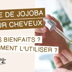 Goutte d'huile de jojoba cheveux tombant d'une pipette sur une mèche. Découvrez ses bienfaits et comment l'utiliser.