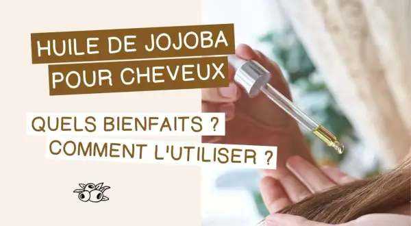 Goutte d'huile de jojoba cheveux tombant d'une pipette sur une mèche. Découvrez ses bienfaits et comment l'utiliser.