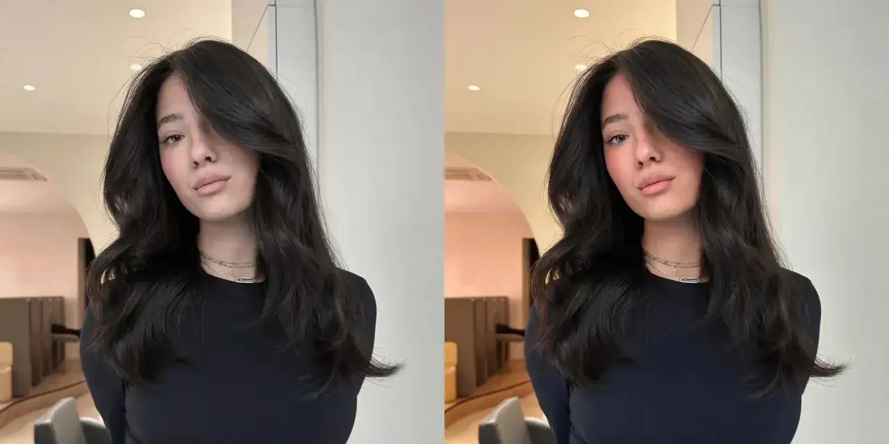 Jeune femme aux cheveux sombres et ondulés, un léger blush sur les joues, une coloration fugace subtile qui illumine son visage.