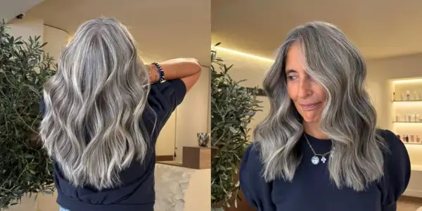 Magnifique balayage sur cheveux poivre et sel, des mèches argentées et grises se fondent avec élégance.