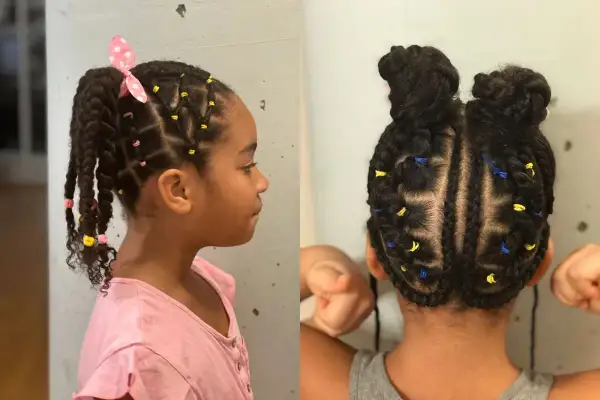 Jolie tresse enfant fille avec des élastiques colorés et un nœud rose. La coiffure est soignée et met en valeur les cheveux de l'enfant.