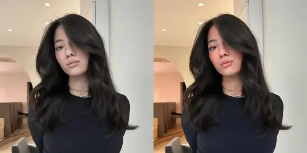 Une jeune femme aux cheveux bruns et ondulés, un look brillant et soigné. Ce style, c'est ce qu'est un gloss en coiffure : une touche d'éclat pour sublimer la chevelure.